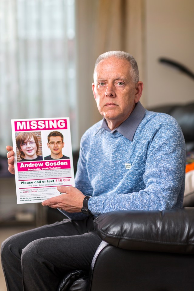 Kevin Gosden holding a missing person poster for his son, Andrew Gosden.