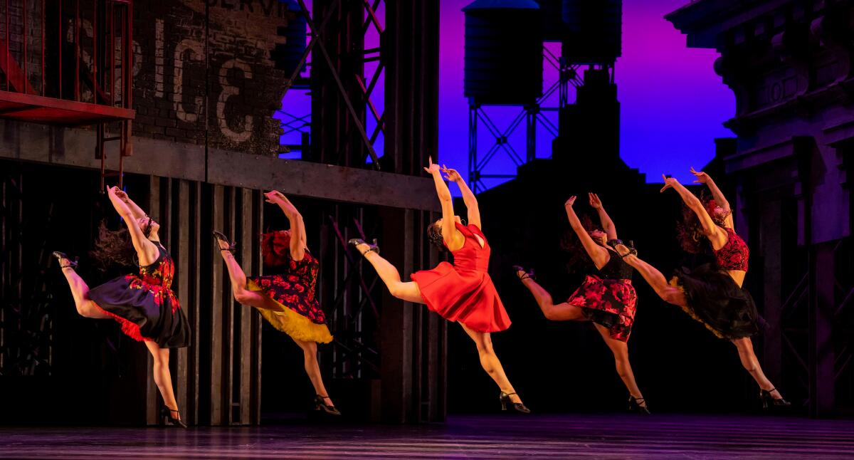 Dancers performing on stage.