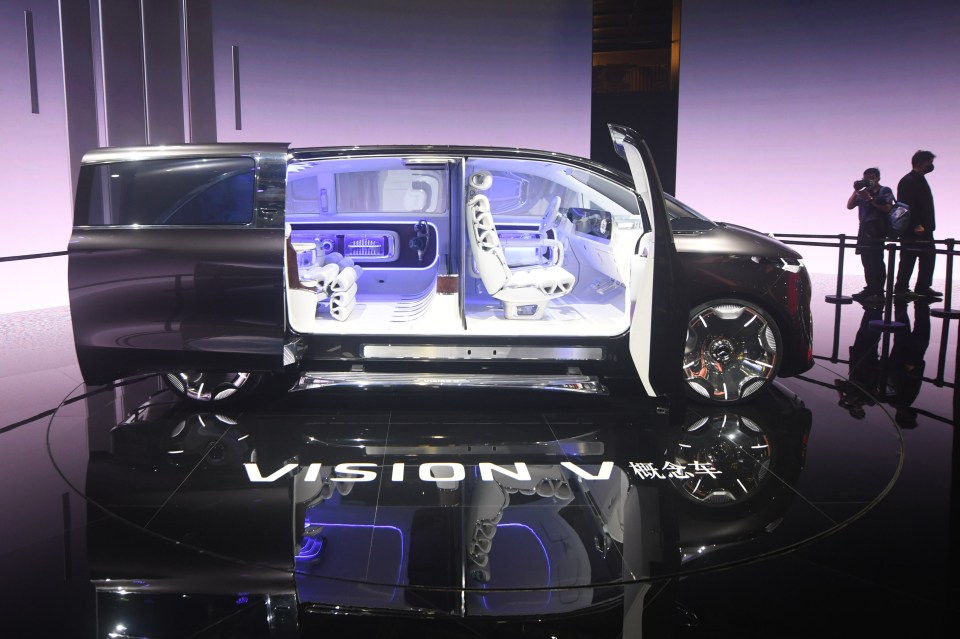 The Mercedes-Benz Vision V concept vehicle with an open side door, showcasing its interior at the Shanghai Auto Show.
