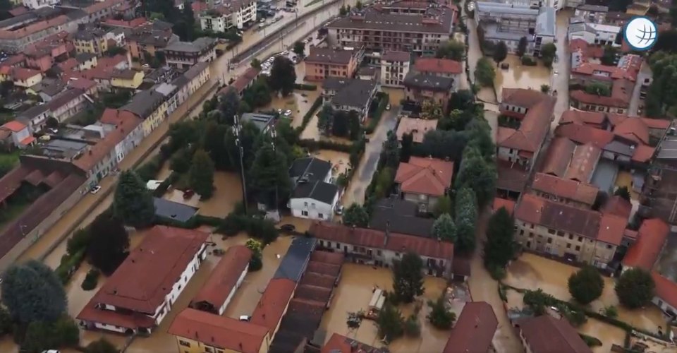 Aerial view of a town submerged in floodwaters.