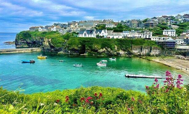 A view of Port Isaac and its harbour on a sunny day