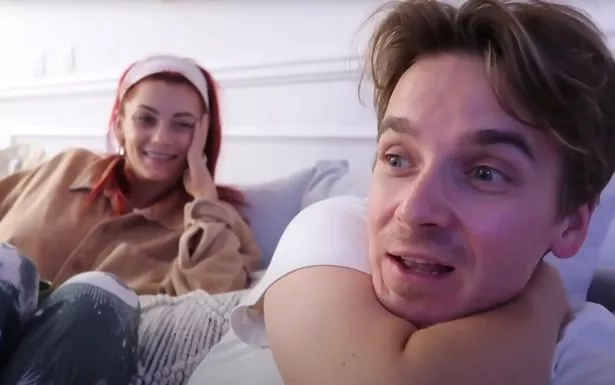 Dianne Buswell and Joe Sugg sat on a sofa together in a vlog.