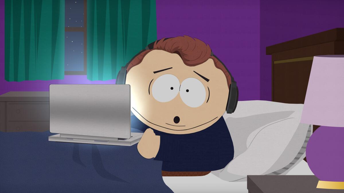 An animated still of a boy sitting up in a bed with a laptop.