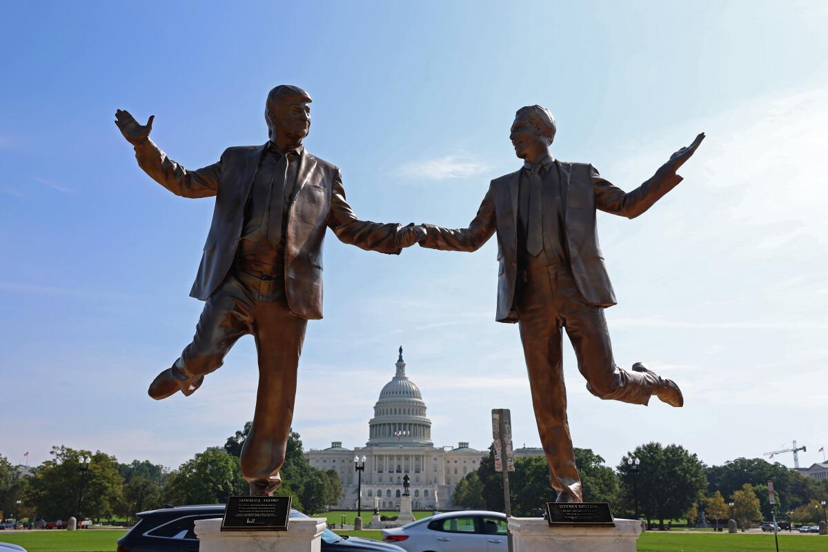 A statue depicting President Trump and Jeffrey Epstein holding hands is seen near the U.S. Capitol
