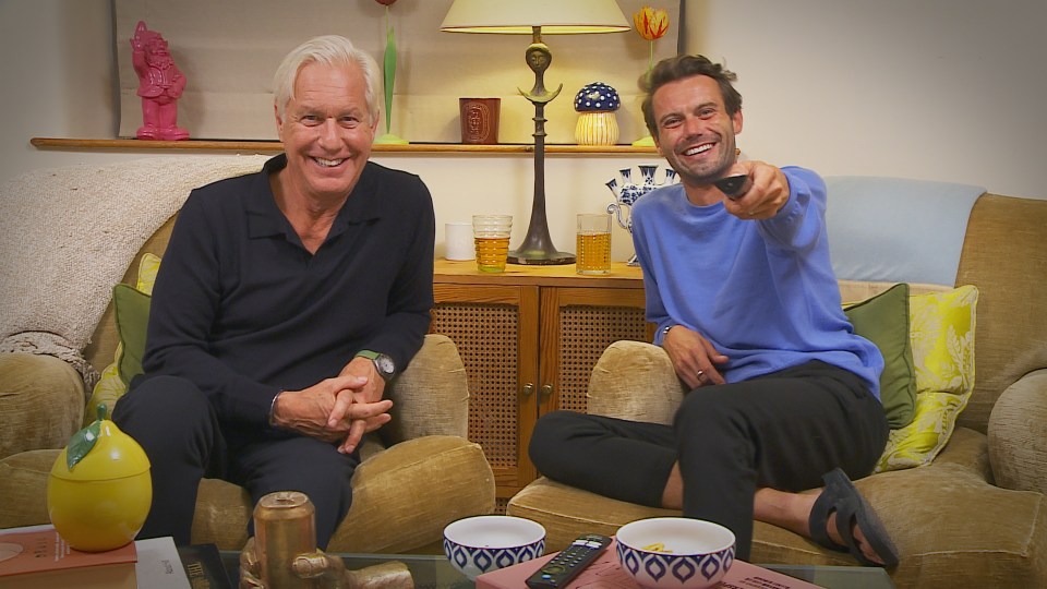 Married couple Andrew and Alfie from the Cotswolds sitting on a couch.