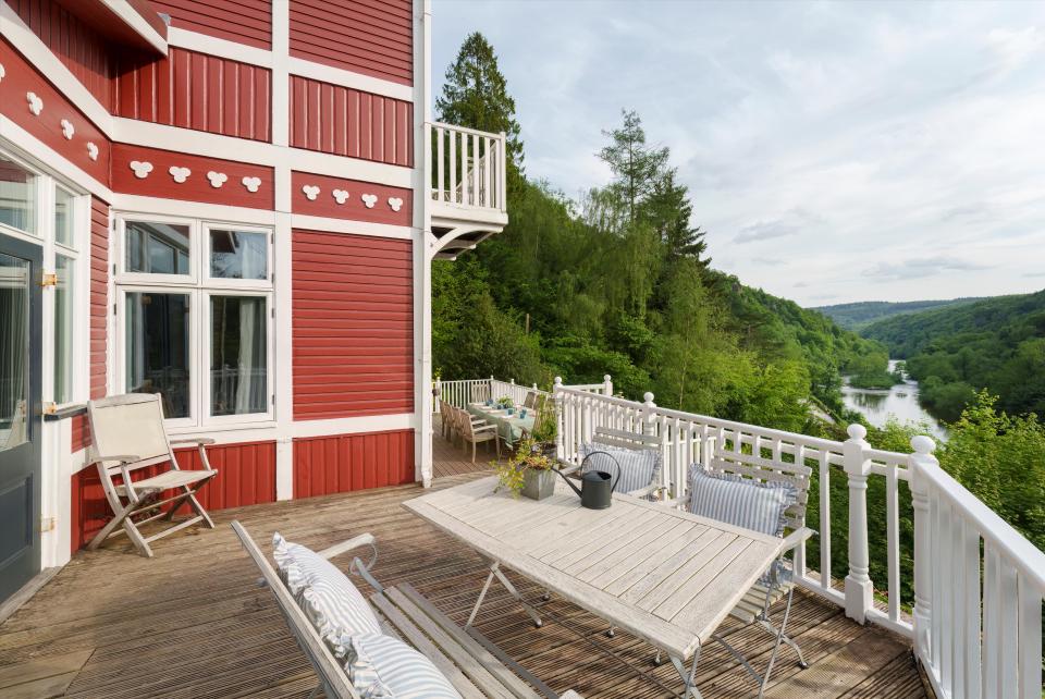 Red Norwegian former fishing lodge with views overlooking the Wye Gorge.