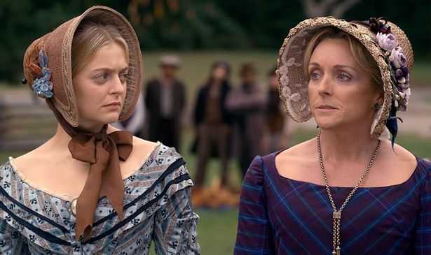 Two women in bonnets look sad