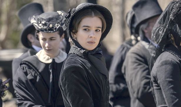 A woman in black looks sad 