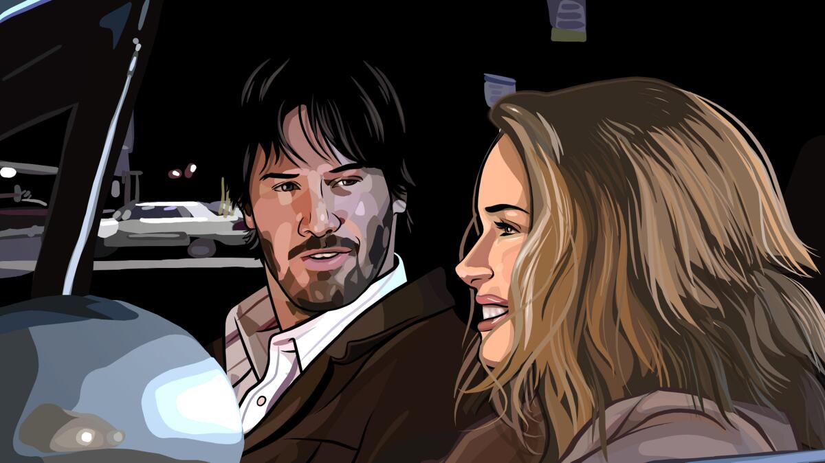 Two people have a conversation in a car.