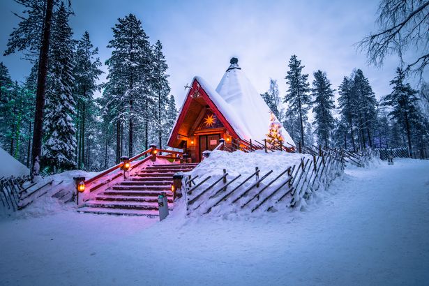 a red house covered in snow 