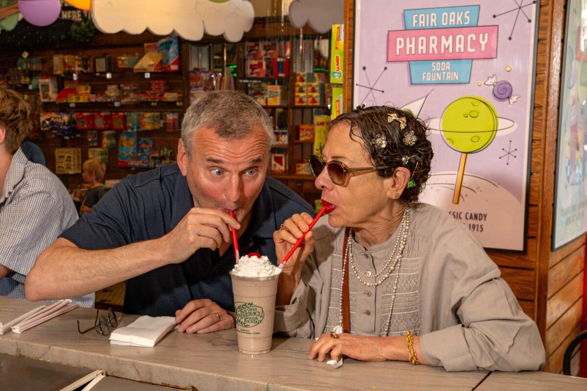 PASADENA, CA-JUNE 23, 2025: Chef Nancy Silverton and Phil Rosenthal share a milkshake at Fair Oaks Pharmacy.
