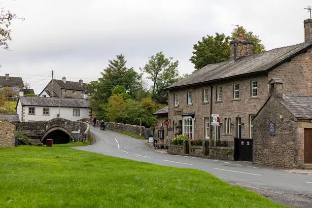 Greenery, housing, narrow street