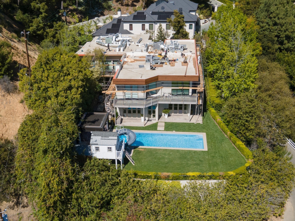 Aerial view of Nicole Kidman and Keith Urban's Los Angeles home with a swimming pool and waterslide.