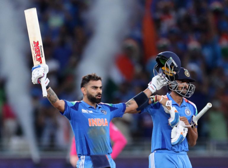 Cricket - ICC Men's Champions Trophy - Group A - India v Pakistan - Dubai International Stadium, Dubai, United Arab Emirates - February 23, 2025 India's Virat Kohli celebrates after hitting four runs to reach his century and win the match REUTERS/Satish Kumar