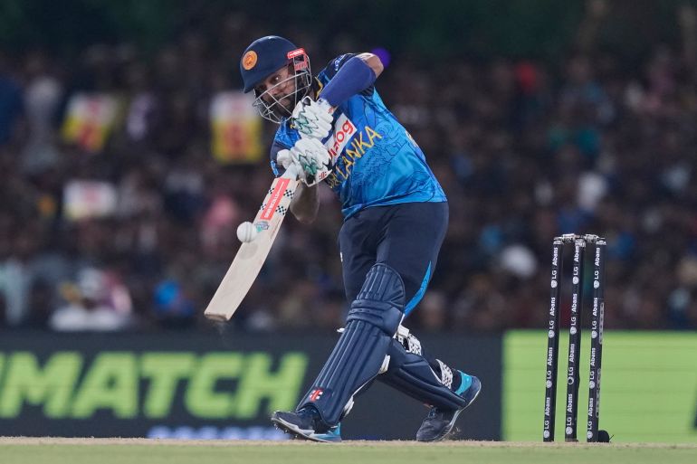 Sri Lanka's Kusal Mendis hits a boundary during the second Twenty20 cricket match between Sri Lanka and Bangladesh in Dambulla