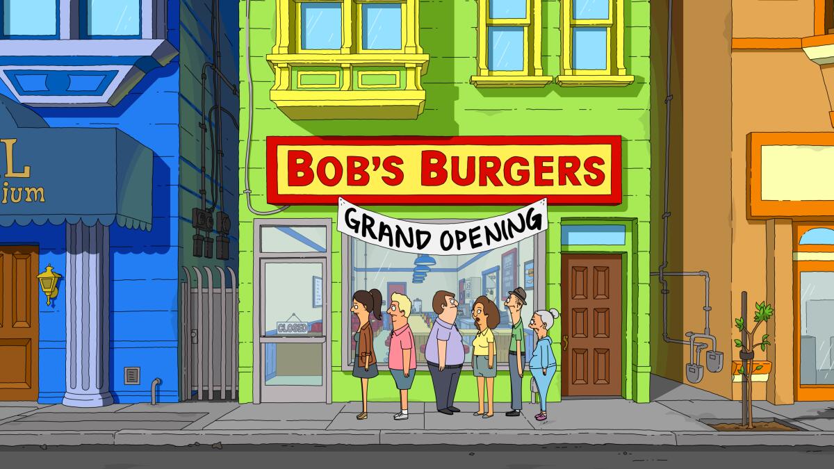 people standing outside a new hamburger restaurant