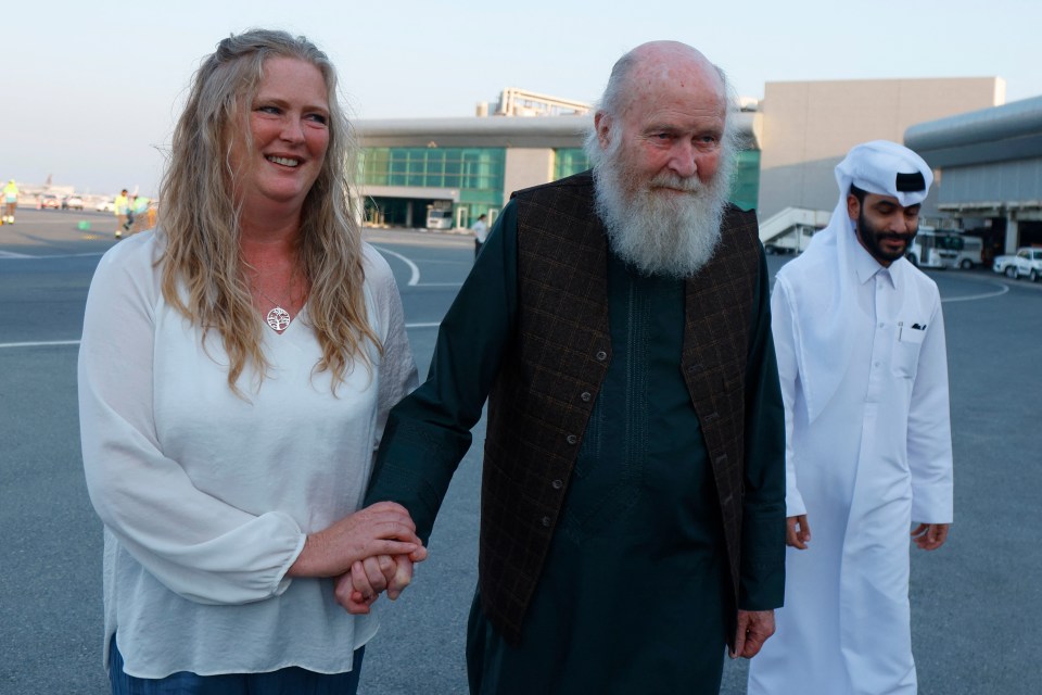 Sarah Entwistle holding her father Peter Reynolds's hand after their release in Afghanistan.