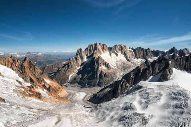 Beautiful sunny day landscape aerial view from helicopter of Glacier du Geant,