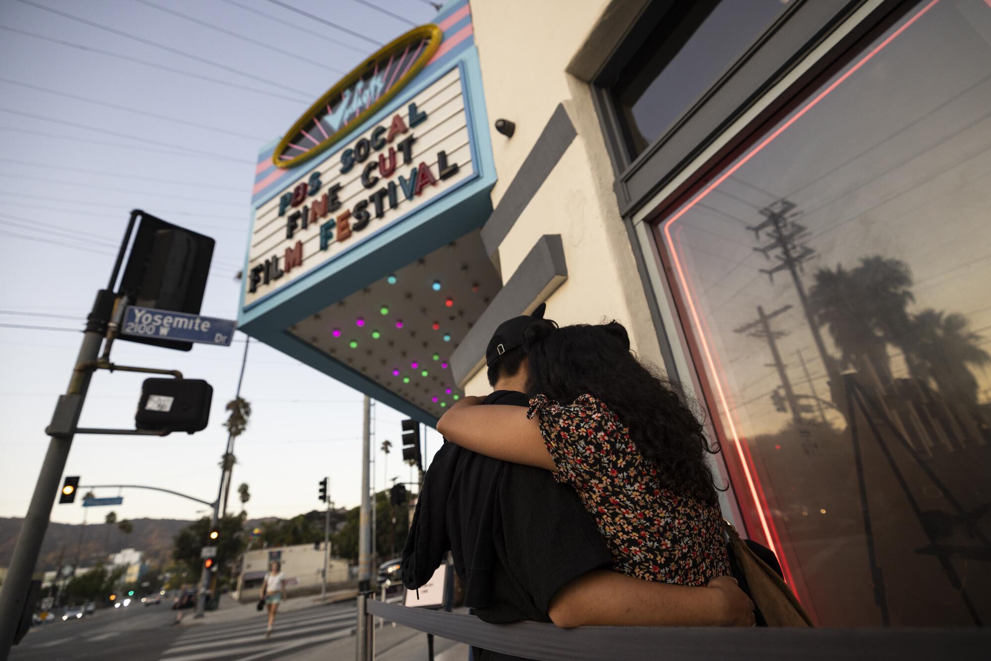Guests wait to enter the Vidiots movie theater for a movie night in Los Angeles.