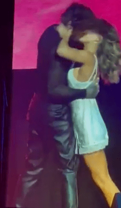 Pete Wicks and Jowita Przystał sharing a passionate kiss on stage.