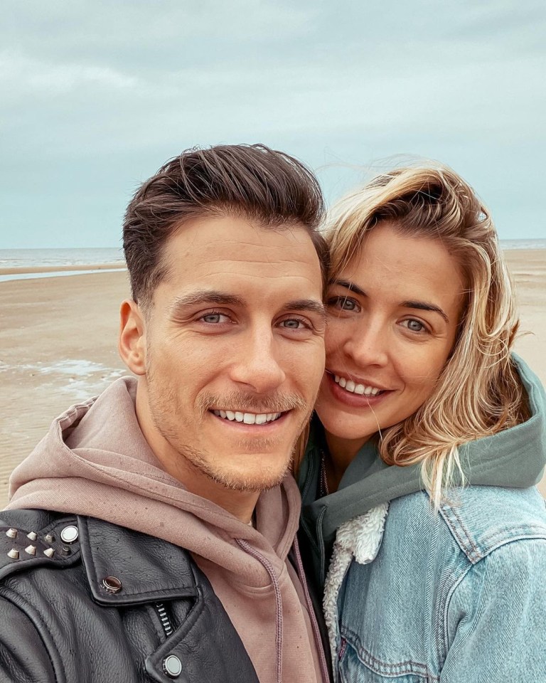 Gemma Atkinson and Gorka Márquez smiling on a beach.
