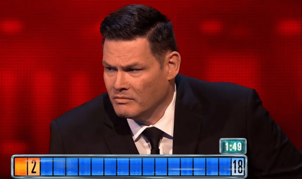 Mark Labbett of The Chase looking angry during the game, with a score of 18 shown.