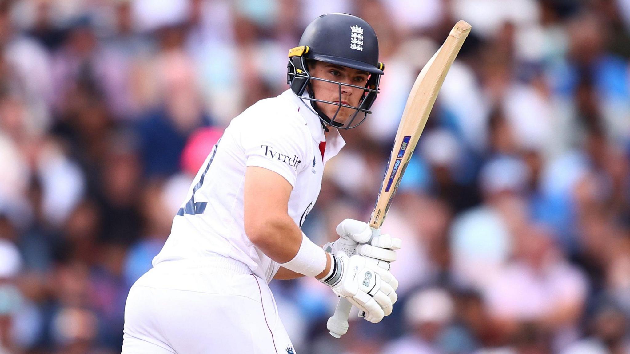 England's Jacob Bethell plays a shot