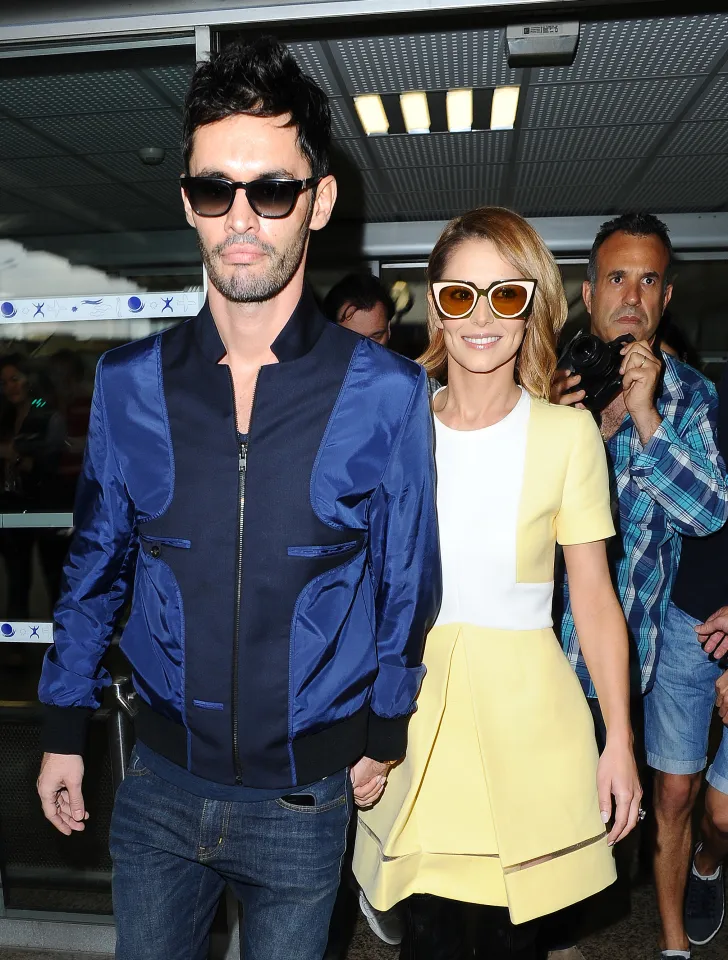 Cheryl Fernandez-Versini and Jean-Bernard Fernandez-Versini walking out of Nice Airport for the Cannes Film Festival.