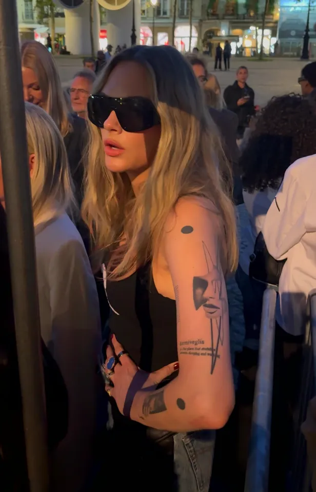 Cara Delevingne with sunglasses at Stella McCartney fashion show.
