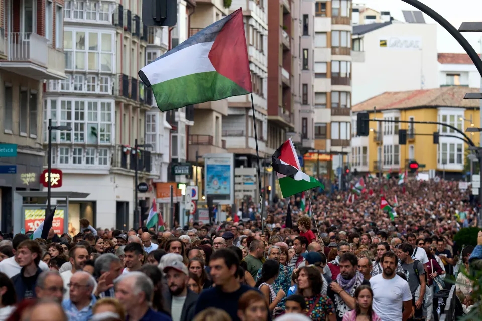 Protesters carrying Palestinian flags gather during a rally in Vitoria, Spain.