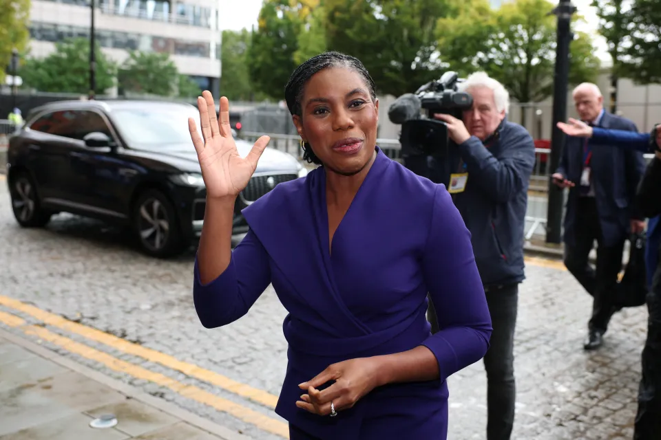 Britain's Conservative Party Leader Kemi Badenoch waves to the camera.