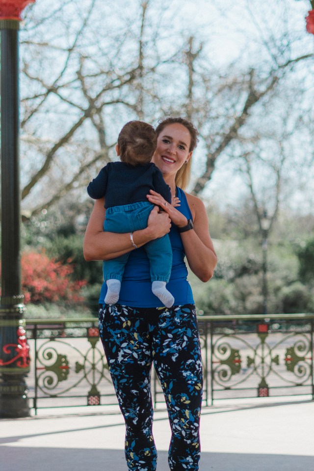 Sarah Campus holding her child.