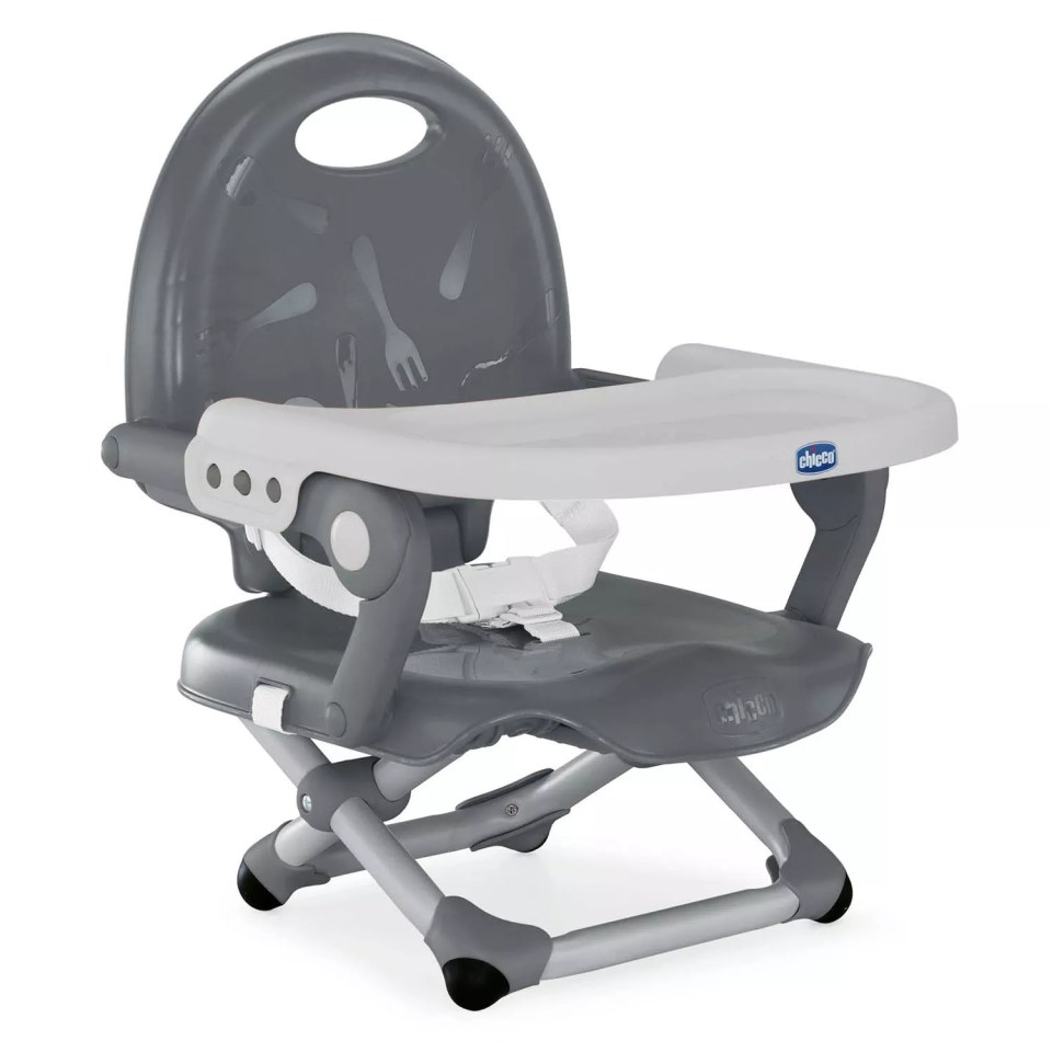 Gray booster seat with a white tray and safety harness.