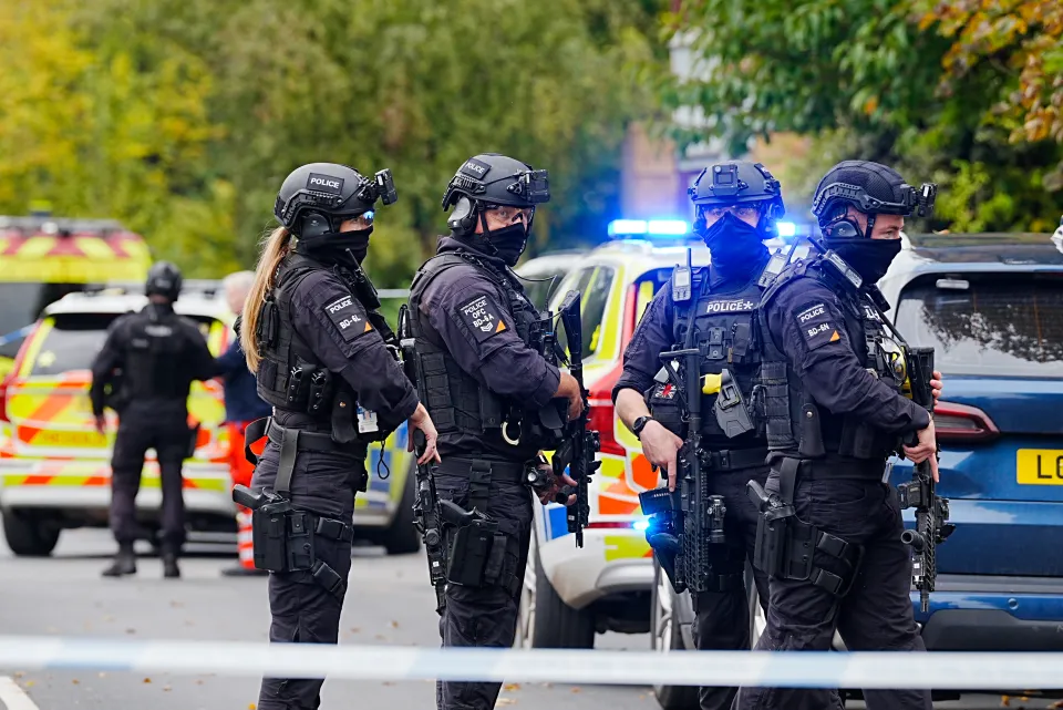Armed police officers at the scene near the Heaton Park Hebrew Congregation synagogue in Crumpsall, Manchester, where two people died in a suspected terror attack.