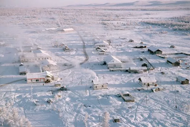 An aerial view of the small town of Oymyakon. Frost hangs on the trees and the temperature is about -45 degrees. (Photo by Dean Conger/Corbis via Getty Images)