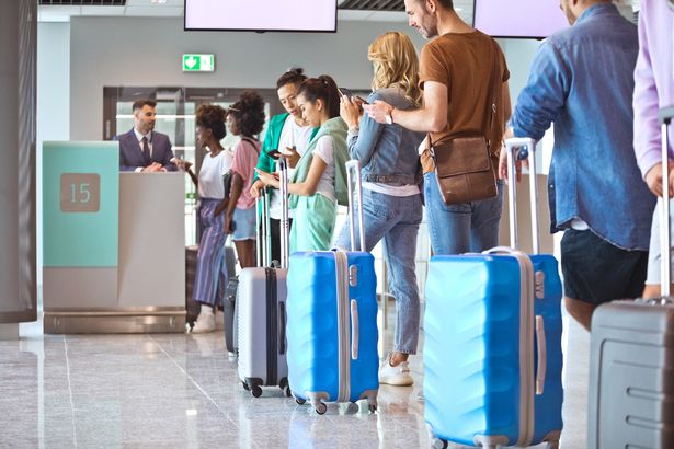 People in airport queue