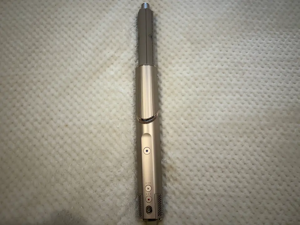 Gold hair styling tool.
