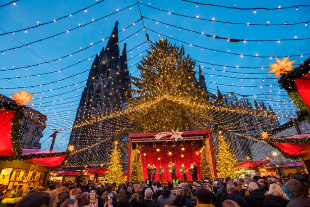 Cologne Christmas market with Cologne Cathedral at dusk - Cologne, North Rhine-Westphalia, Germany