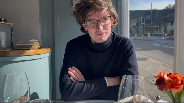 Milo sitting at a table