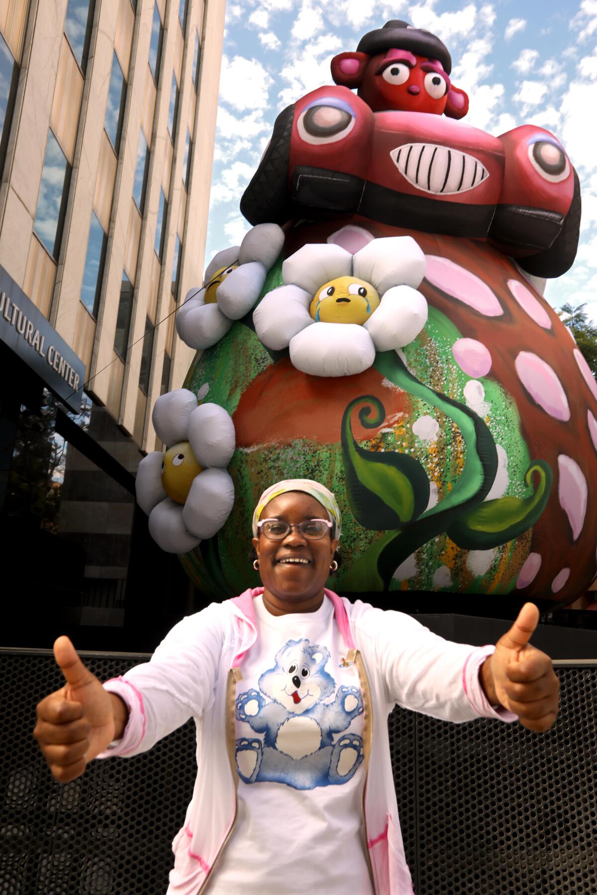 Artist Alake Shilling in front of a 25-foot inflatable bear, "Buggy Bear Crashes Made in L.A."