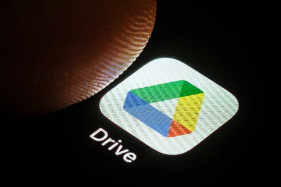 Photo illustration of the Google Drive app icon on a smartphone screen.
