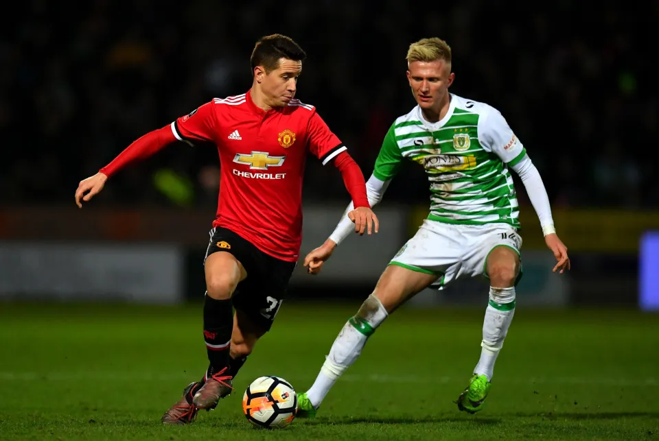 Ander Herrera of Manchester United and Sam Surridge of Yeovil Town during The Emirates FA Cup Fourth Round match.