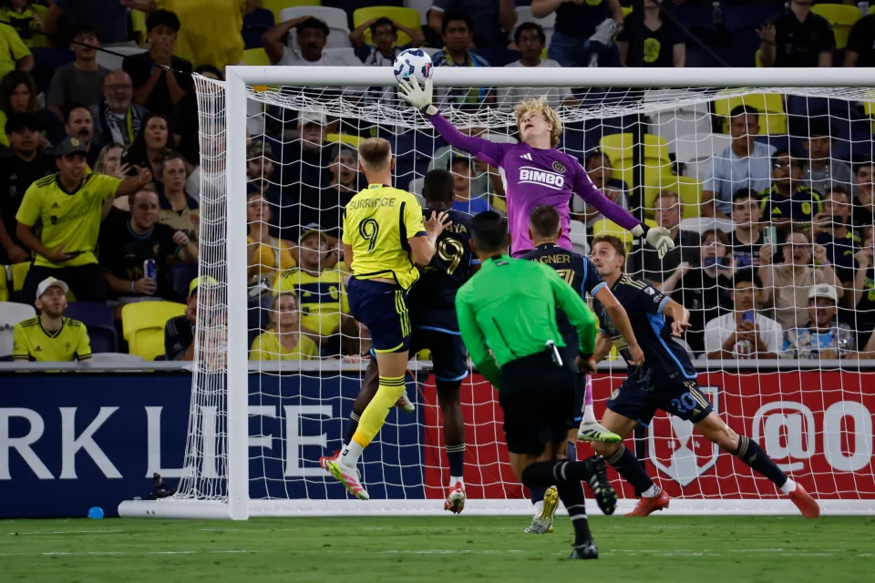 Nashville SC forward Sam Surridge #9 heads a ball into the goal past Philadelphia Union goalkeeper Andrew Rick #76.
