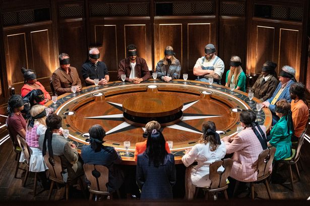 The contestants gather around the notorious round table