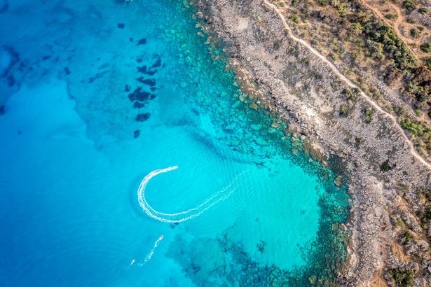 Aerial view of blue waters in Konnos Bay Beach in Ayia Napa