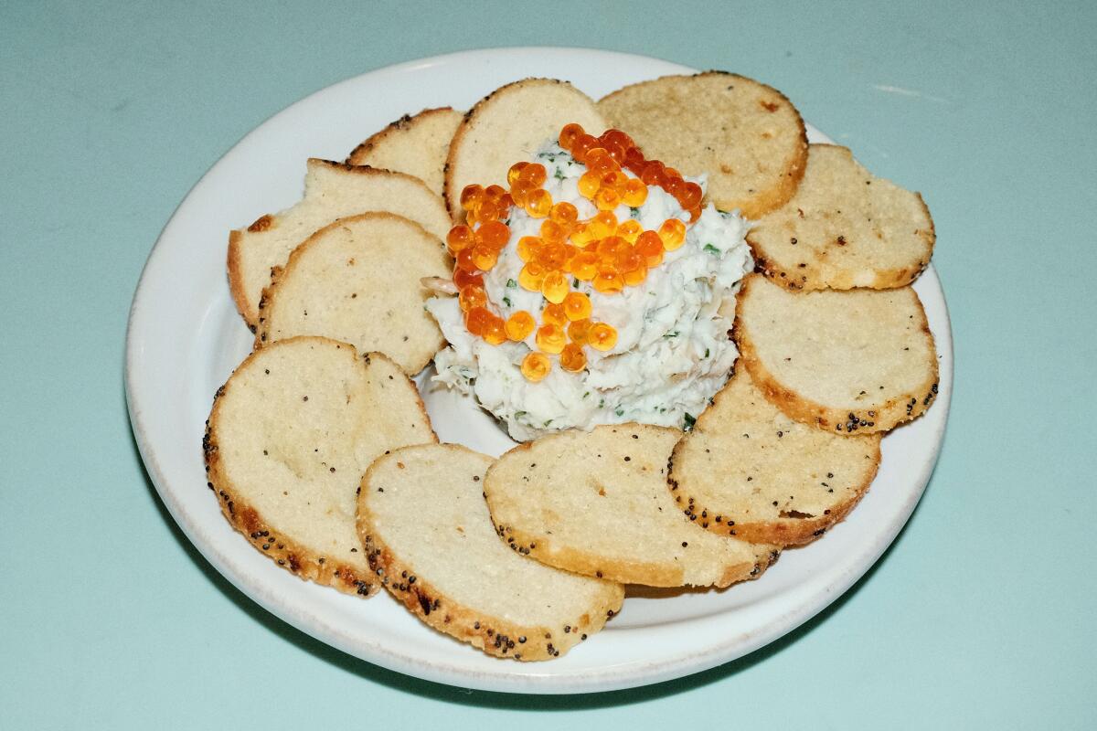 Fish dip topped with trout roe, ringed with a circle of crostini, at Cento Raw Bar.