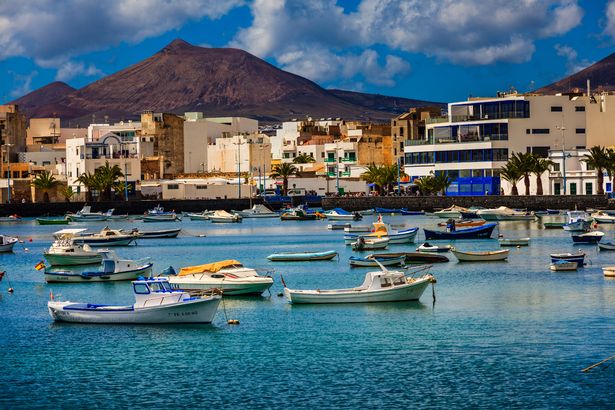Small fishing boats on the water outside the capital Arrecife in Lanzarote