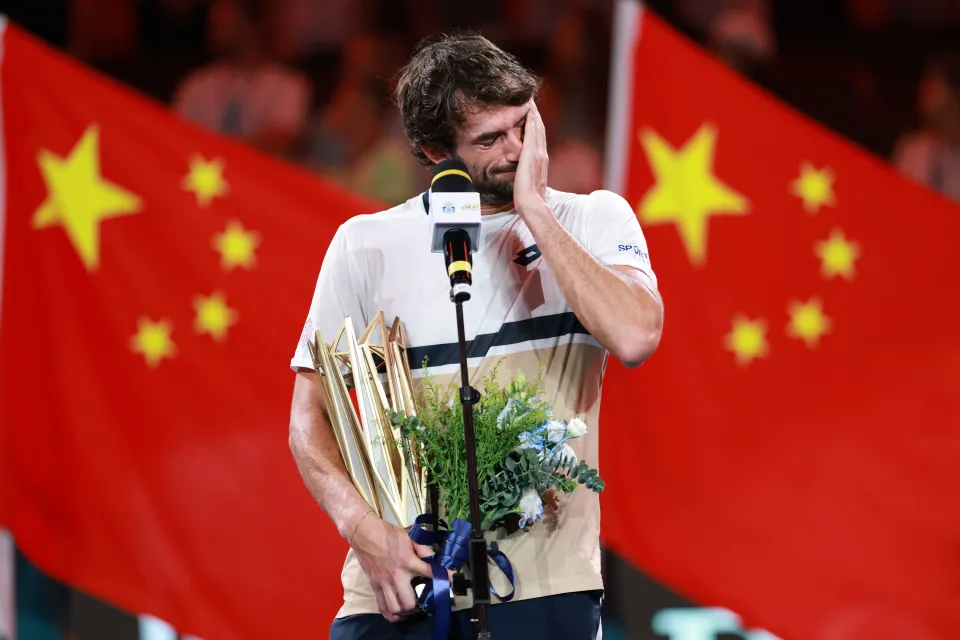 Valentin Vacherot of Monaco reacting with his winner's trophy at the Shanghai Rolex Masters.