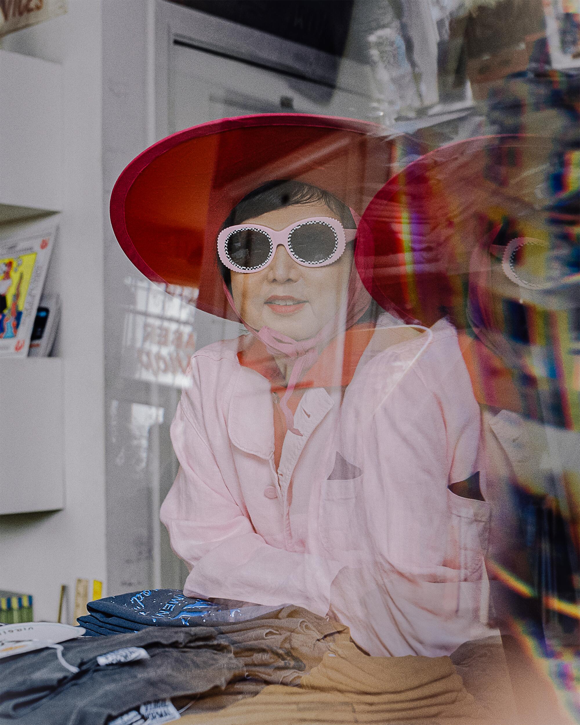Shirley wears vintage hat, Meals Clothing top, shirt and dress, and l.a. Eyeworks sunglasses.