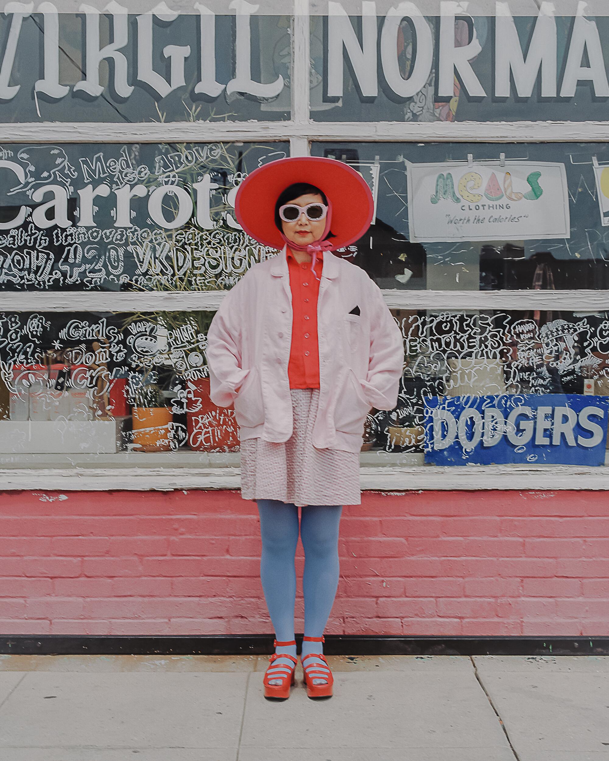 Shirley wears vintage hat, Meals Clothing top, shirt and dress, tights, shoes and l.a. Eyeworks sunglasses.